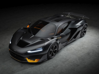 Hypercar McLaren W1 2025 vue de trois quarts avant, carrosserie noir mat et inserts orange